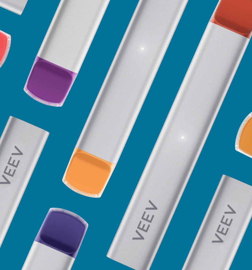 Collection of VEEV NOW devices on a blue background